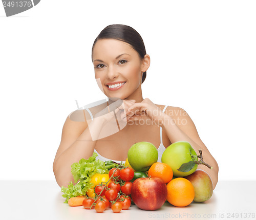 Image of happy woman with lot of fruits and vegetables