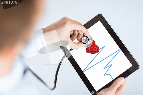 Image of doctor with stethoscope and tablet pc