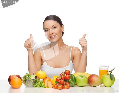 Image of happy woman with fruits and vegetables