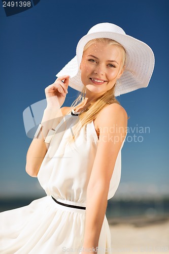 Image of beautiful woman enjoying summer outdoors