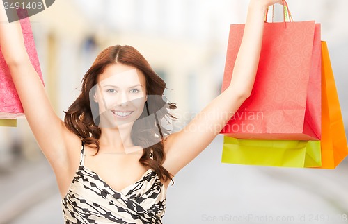 Image of woman with shopping bags in ctiy