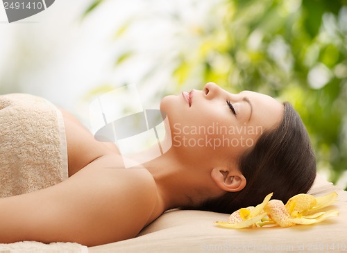 Image of woman in spa lying on the massage desk