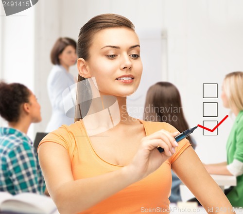 Image of student drawing checkmark on virtual screen