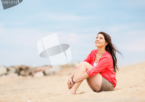 Image of girl sitting on the beach