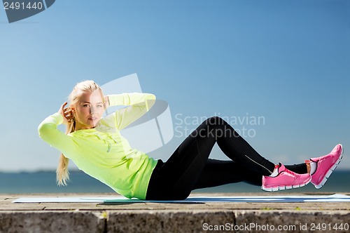 Image of woman doing sports outdoors