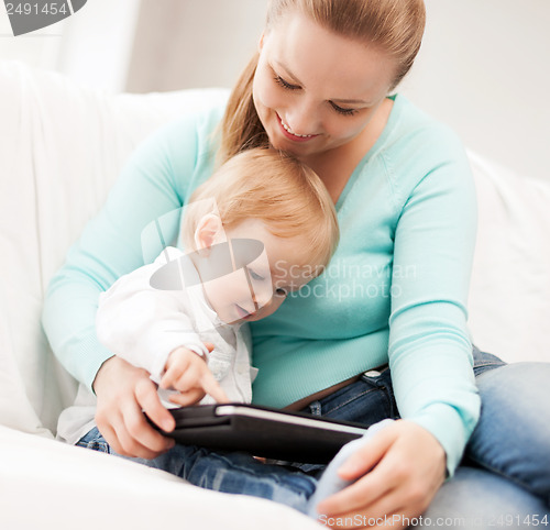 Image of mother and adorable baby with tablet pc