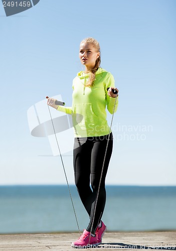 Image of woman doing sports outdoors