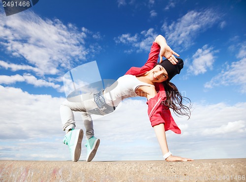 Image of beautiful dancing girl in movement