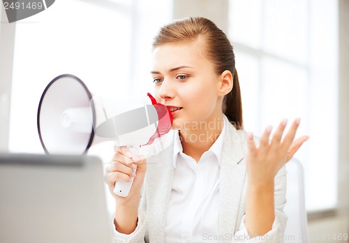 Image of strict businesswoman shouting in megaphone