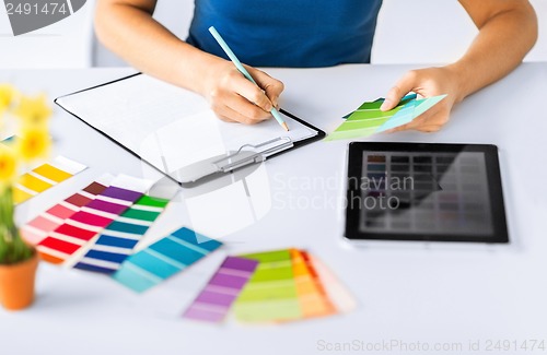 Image of woman working with color samples for selection