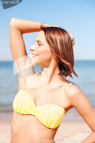 Image of girl posing on the beach
