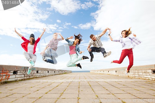 Image of group of teenagers jumping