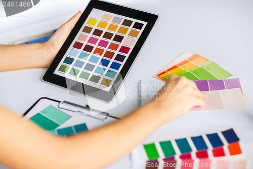 Image of woman working with color samples for selection