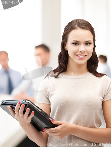 Image of businesswoman with tablet pc in office