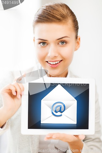 Image of businesswoman holding tablet pc with email sign