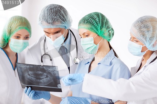 Image of young group of doctors looking at x-ray