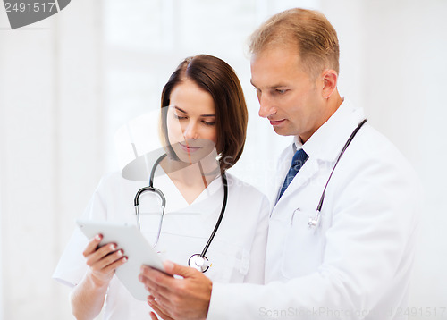 Image of two doctors looking at tablet pc