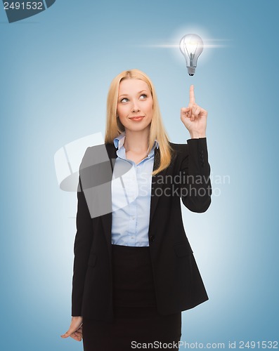 Image of woman pointing at light bulb