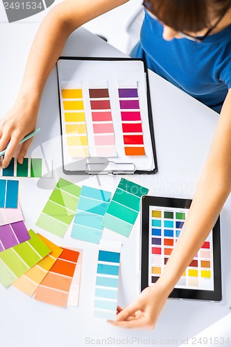 Image of woman working with color samples for selection