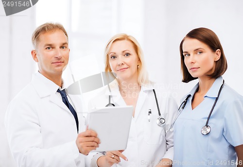 Image of doctors looking at tablet pc