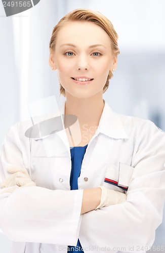 Image of smiling female doctor in hospital