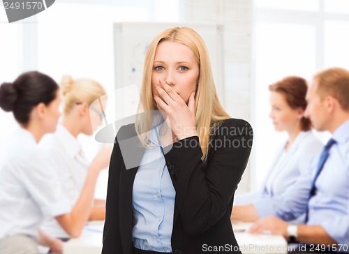 Image of stressed businesswoman in office