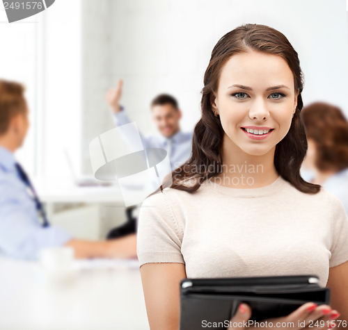 Image of businesswoman with tablet pc in office