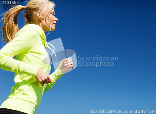 Image of woman doing running outdoors