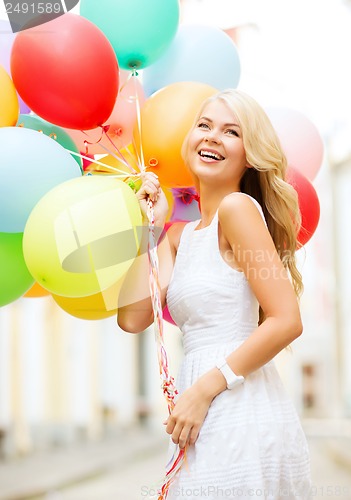 Image of woman with colorful balloons