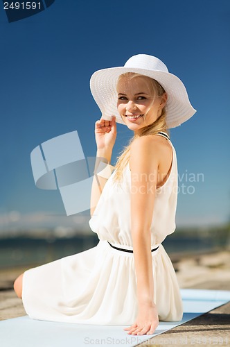 Image of beautiful woman enjoying summer outdoors