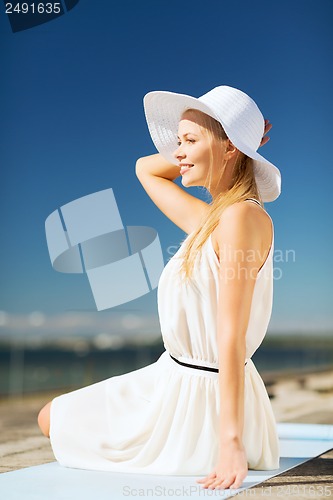 Image of beautiful woman enjoying summer outdoors