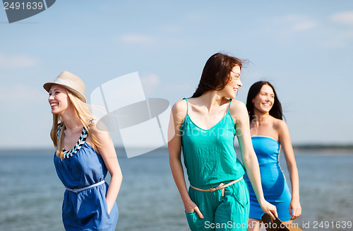 Image of girls walking on the beach