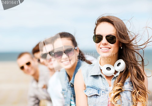 Image of teenage girl with friends outside