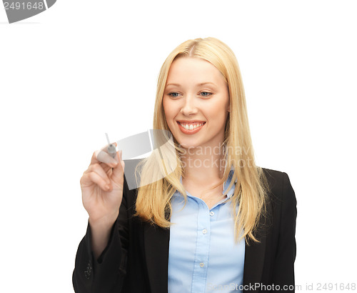 Image of businesswoman writing something in the air