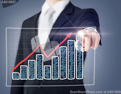 Image of businessman hand with chart on virtual screen