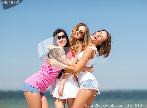 Image of group of girls chilling on the beach