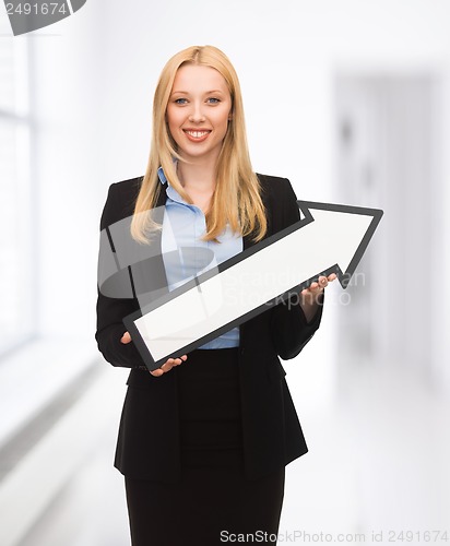 Image of businesswoman with direction arrow sign