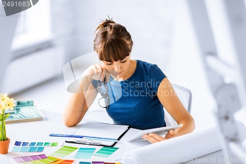 Image of woman working with color samples for selection