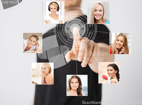 Image of man with virtual screen and contact icons