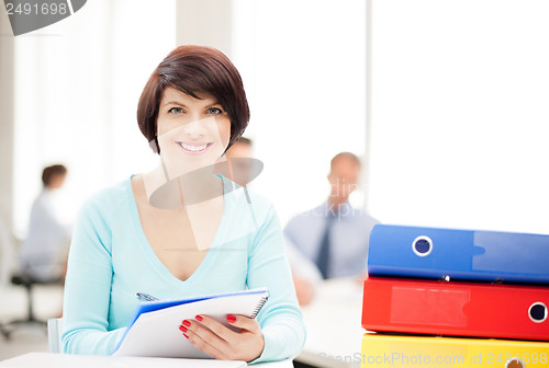 Image of woman with folders