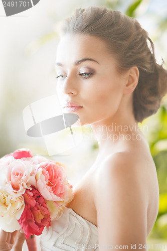 Image of young woman with bouquet of flowers