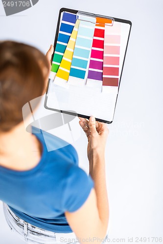 Image of woman working with color samples for selection