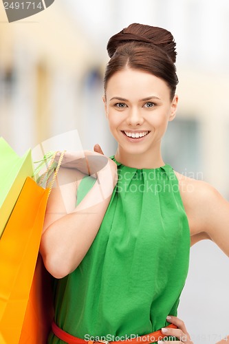 Image of woman with shopping bags in ctiy