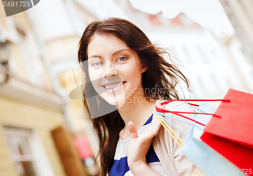 Image of woman with shopping bags in ctiy