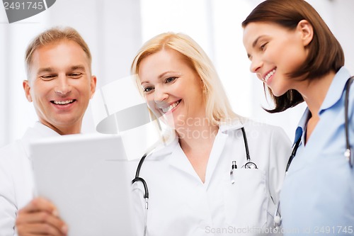 Image of doctors looking at tablet pc