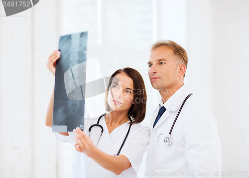 Image of two doctors looking at x-ray