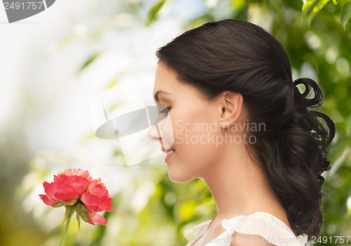 Image of young woman with flower