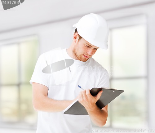 Image of male architect looking at blueprint