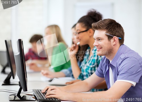 Image of students with computers studying at school