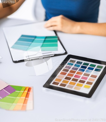 Image of woman working with color samples for selection